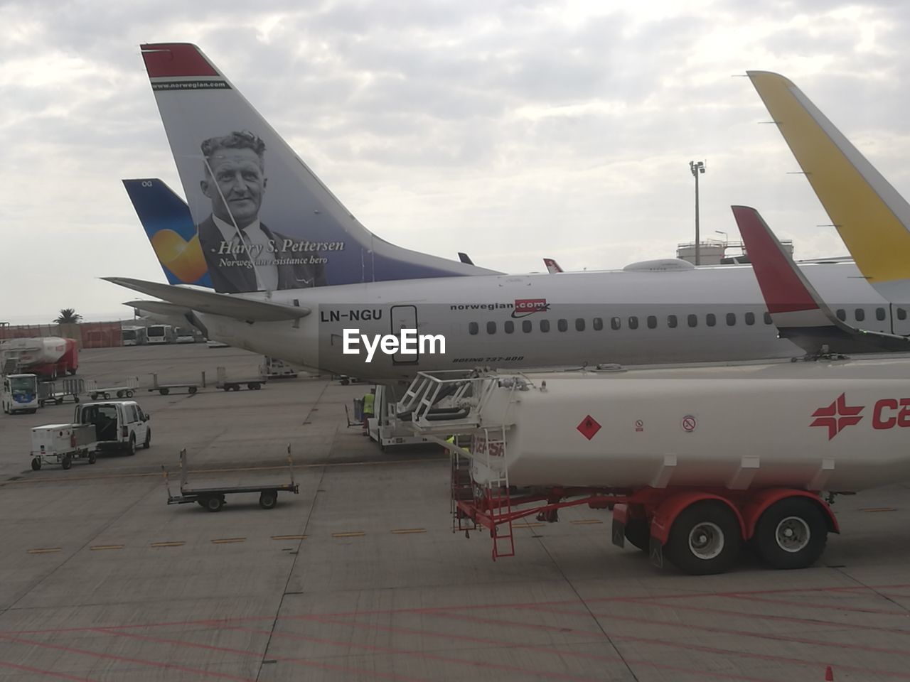 AIRPLANE FLYING AT AIRPORT