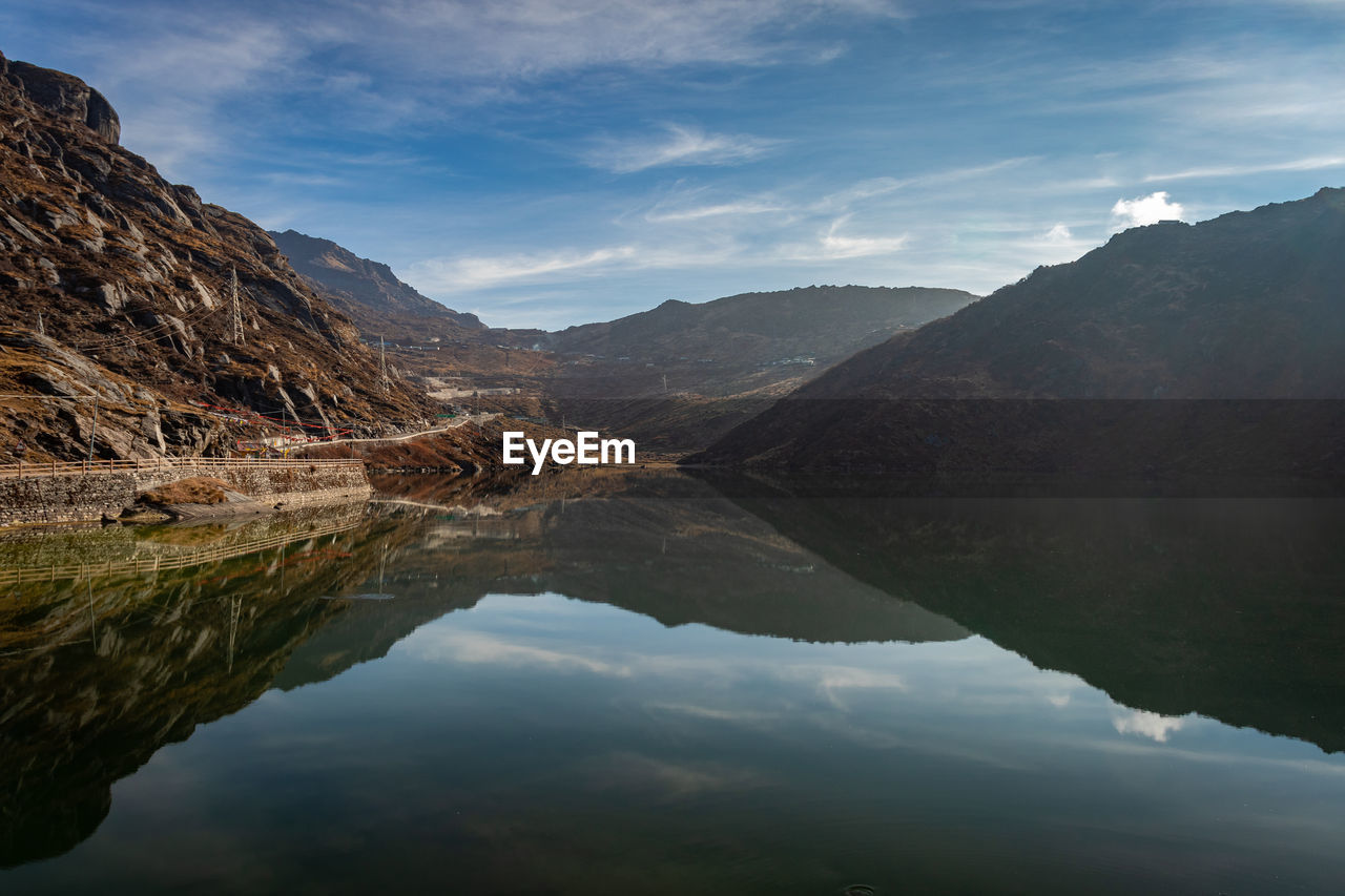 Pristine lake surrounded by himalayan mountain with pristine water reflection isolated view