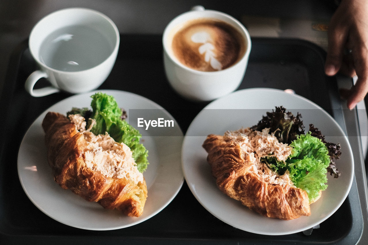 High angle view of food served in plates on table