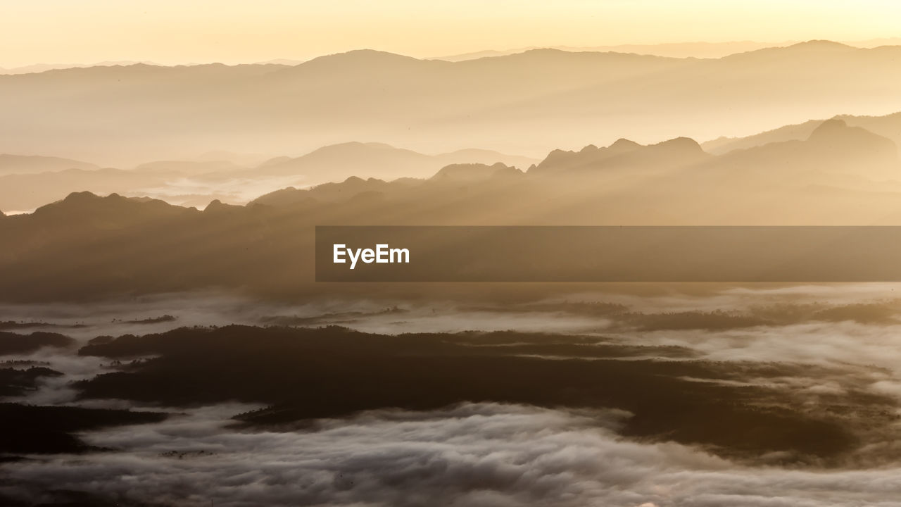 Scenic view of mountains against sky during sunset