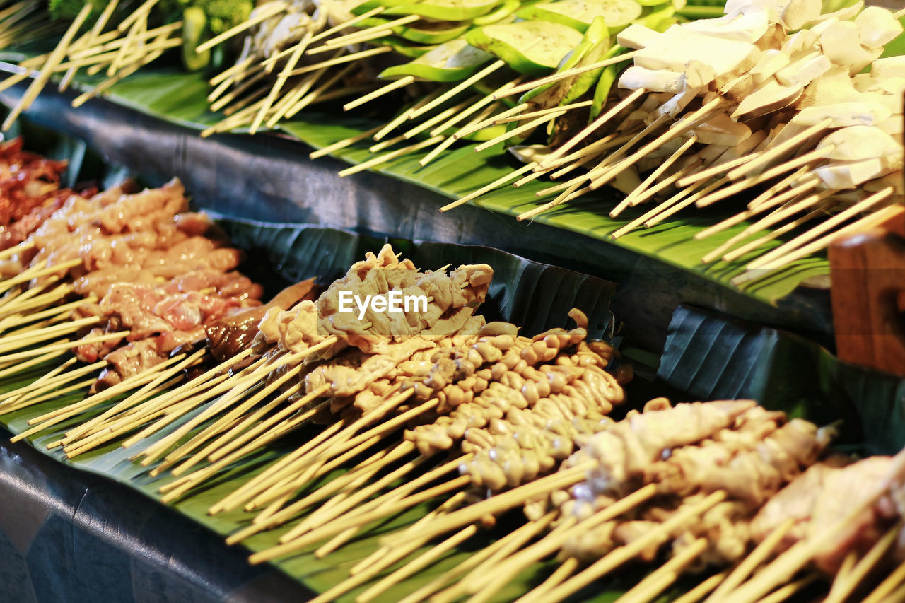 Fresh thai bar-b-q barbecue on banana leaf at street food night market in thailand