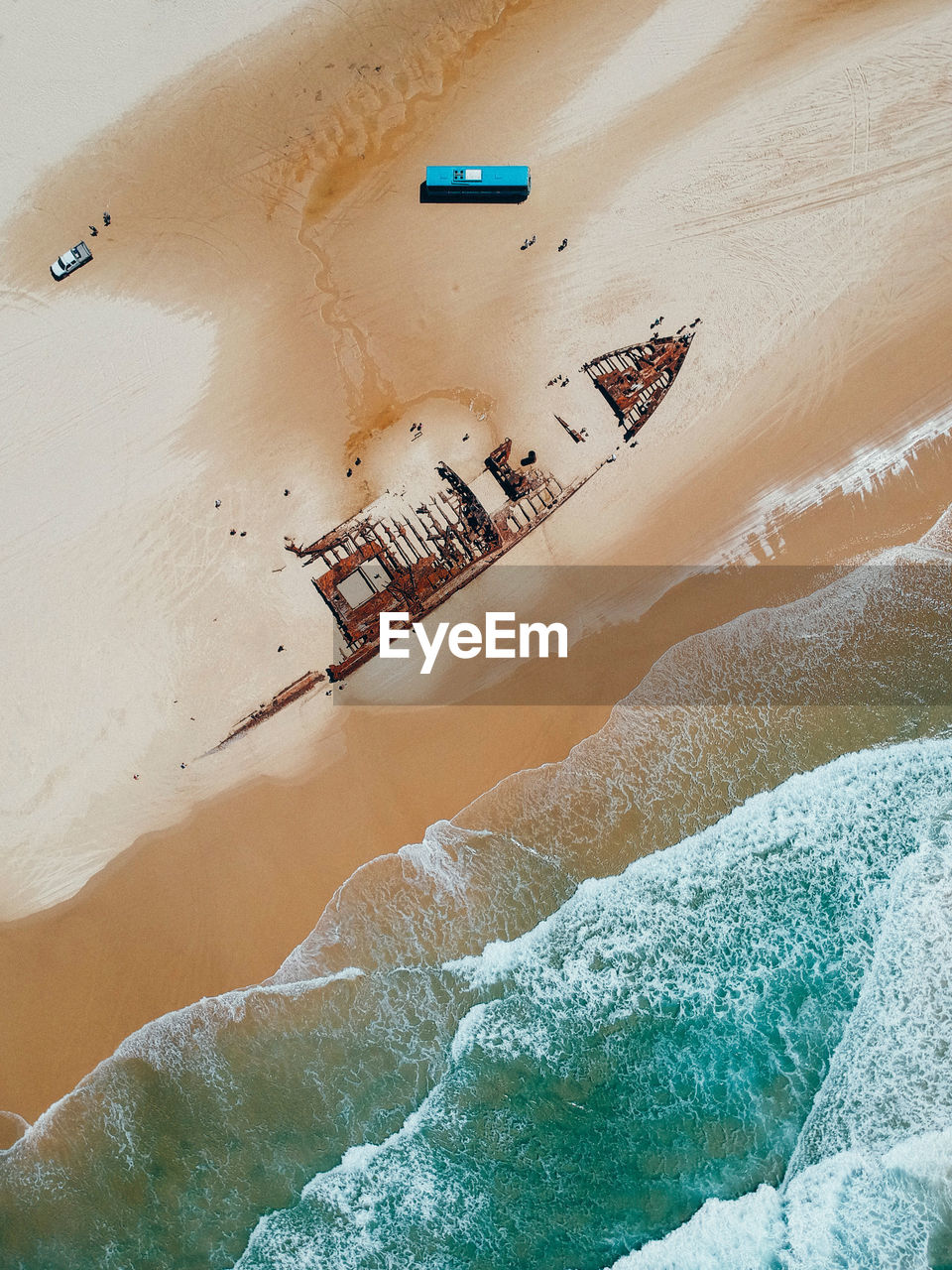 Aerial view of shipwreck on shore at beach