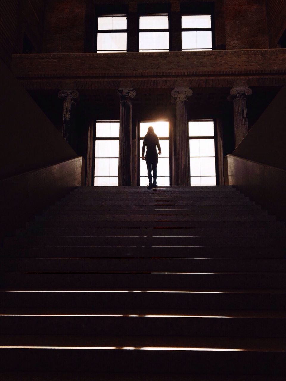 Low angle view of person standing on steps in neues museum
