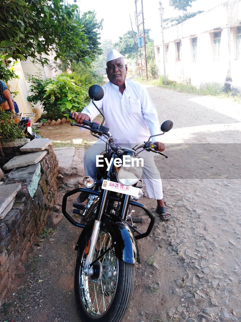 Indian old man riding bicycle