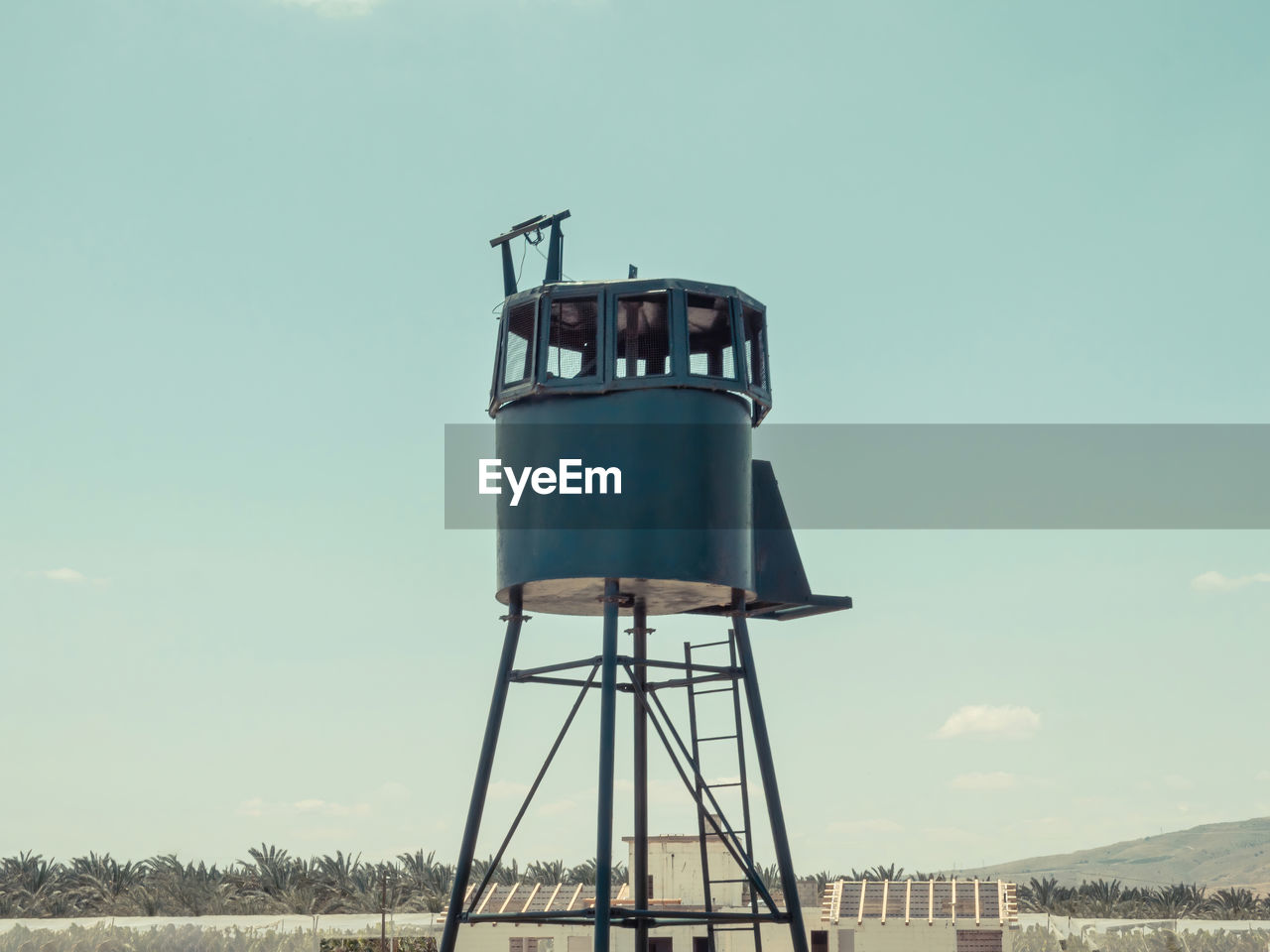 An old army guard metallic watchtower. in kibbutz degania, israel. 