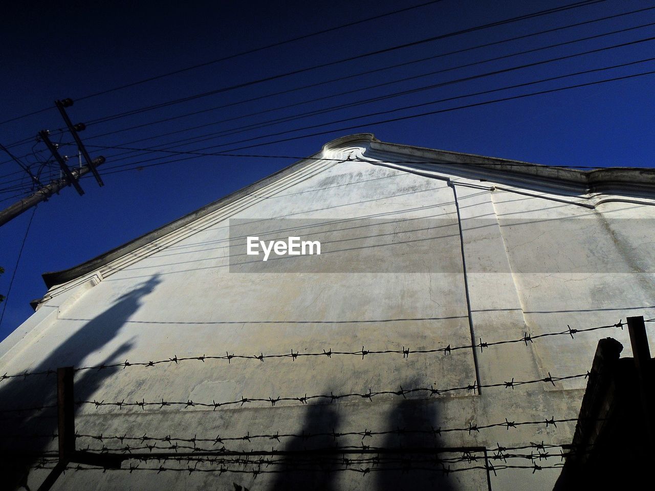 Low angle view of built structure against blue sky