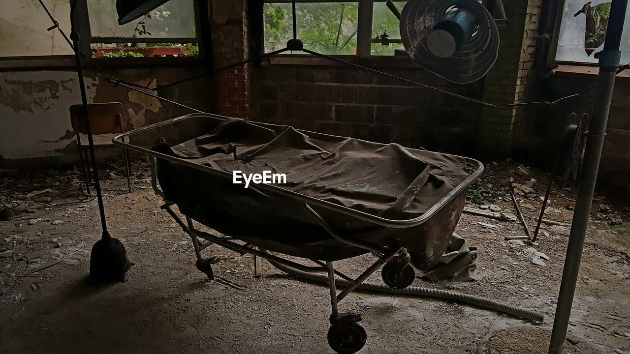 ABANDONED CHAIR IN ROOM