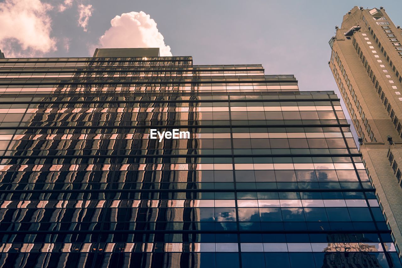 Low angle view of modern buildings against sky