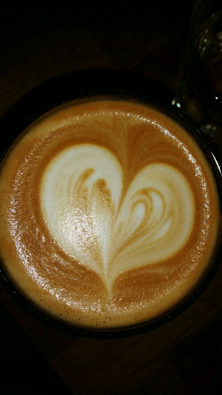 CLOSE-UP OF COFFEE CUP ON TABLE