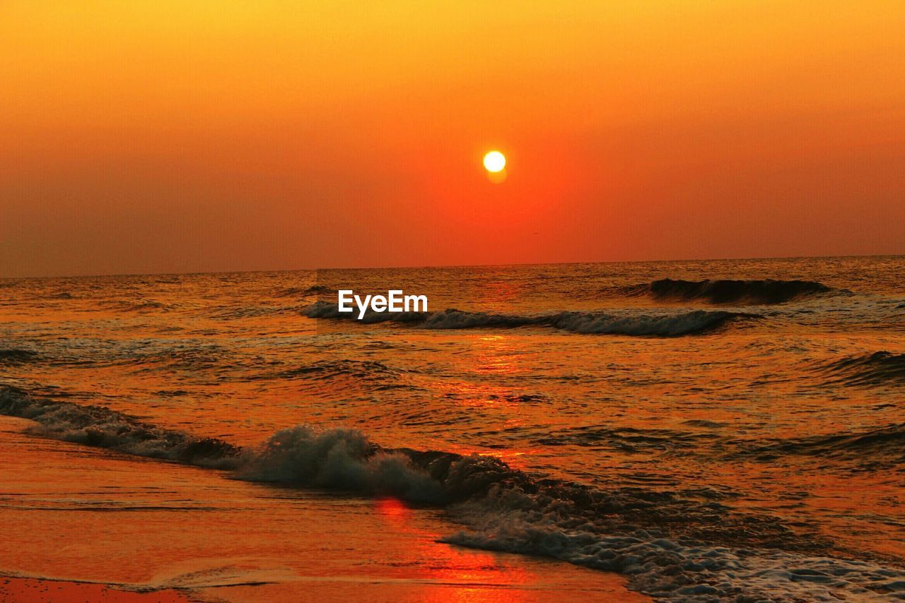 Scenic view of sea against sky during sunset