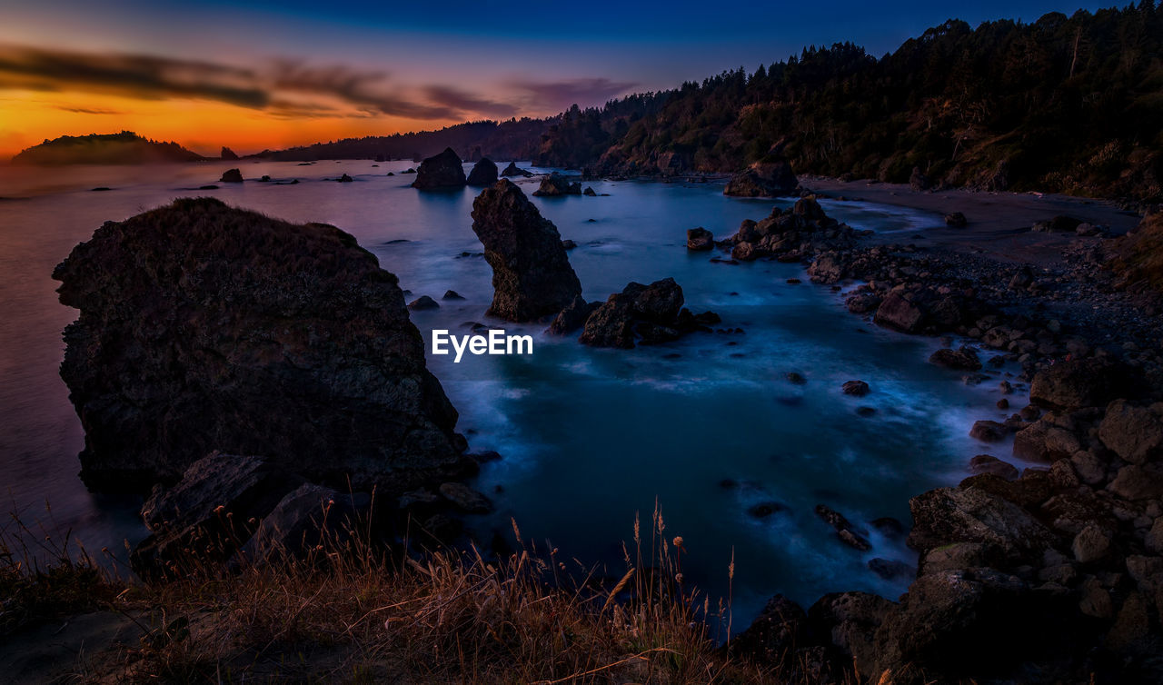 Scenic view of sea against sky during sunset
