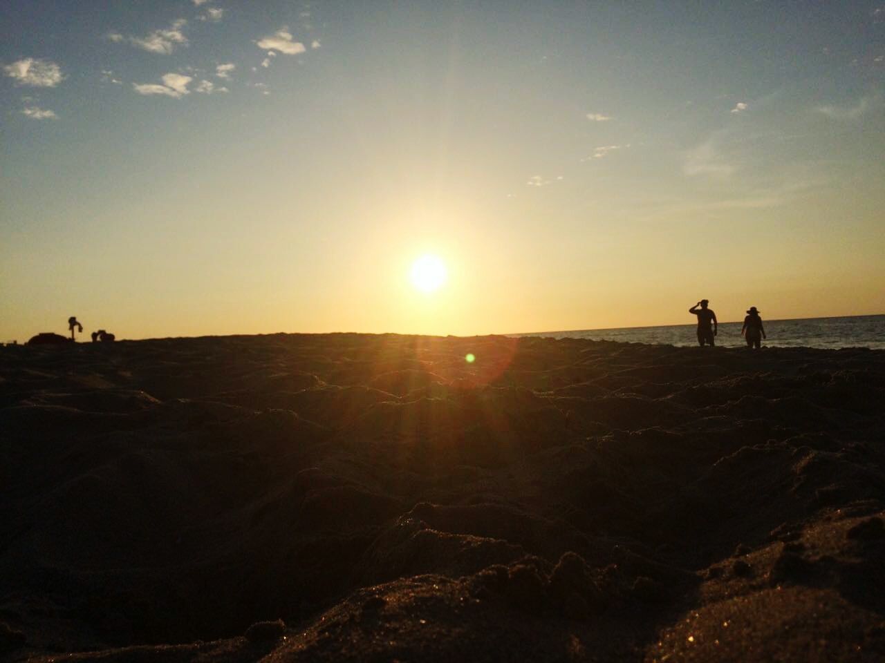 SILHOUETTE PEOPLE ON LANDSCAPE AGAINST SKY AT SUNSET