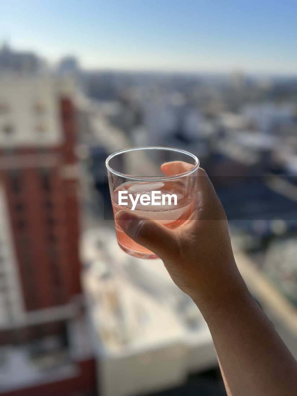 Drinking a cold drink outside balcony of hotel 