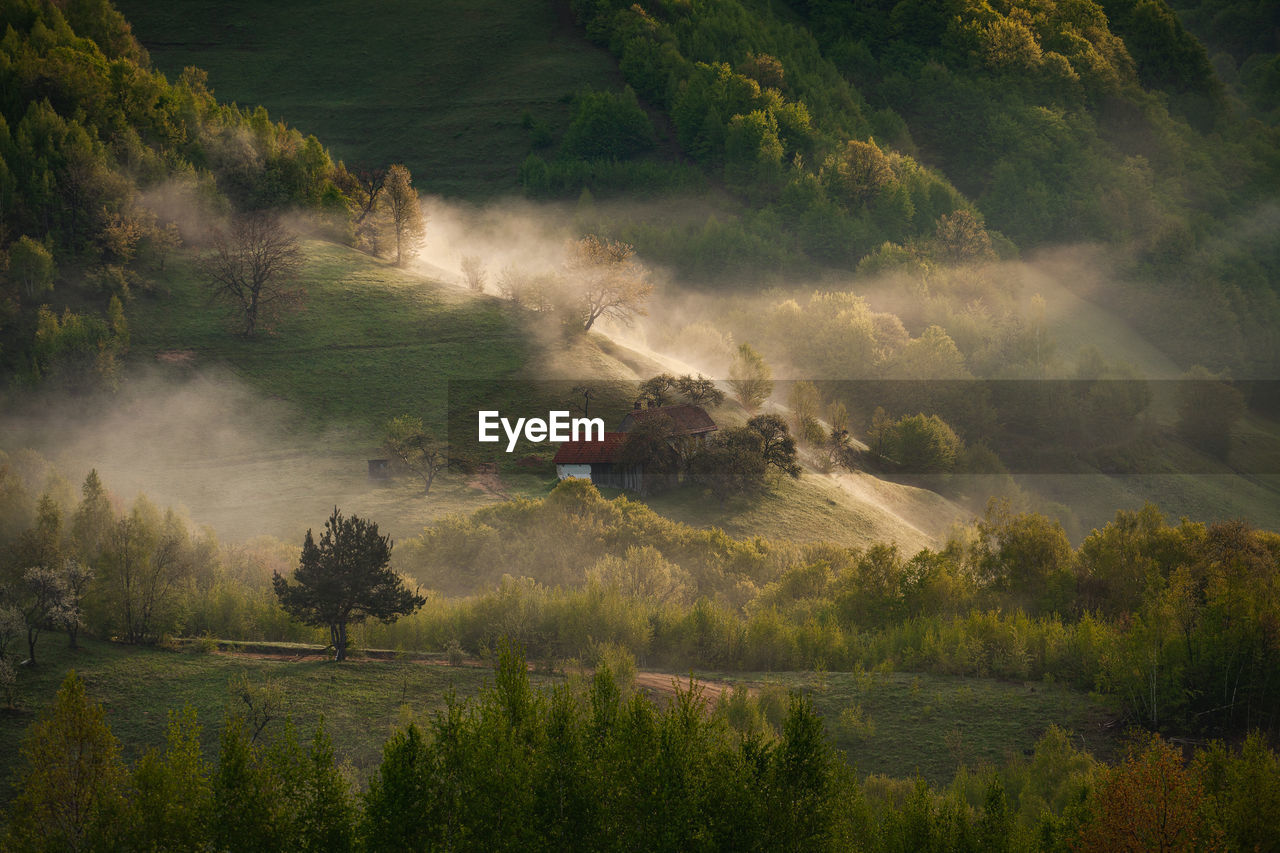 Morning rural scene of a mountain village in the spring season.