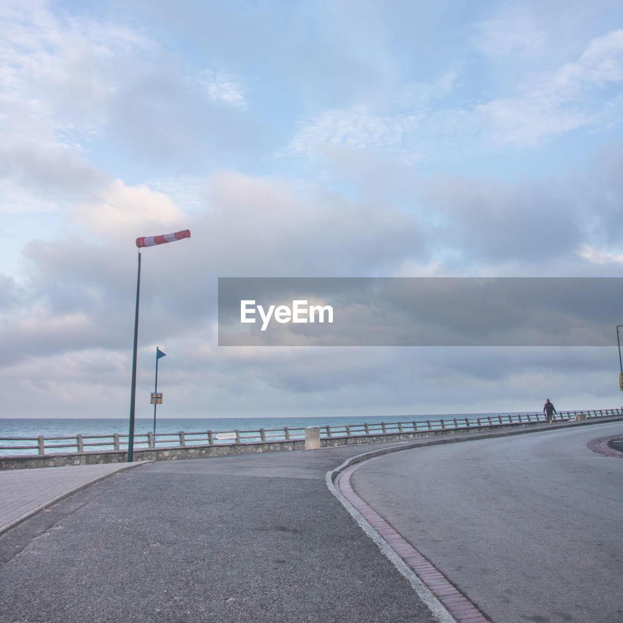 VIEW OF BRIDGE OVER SEA AGAINST SKY