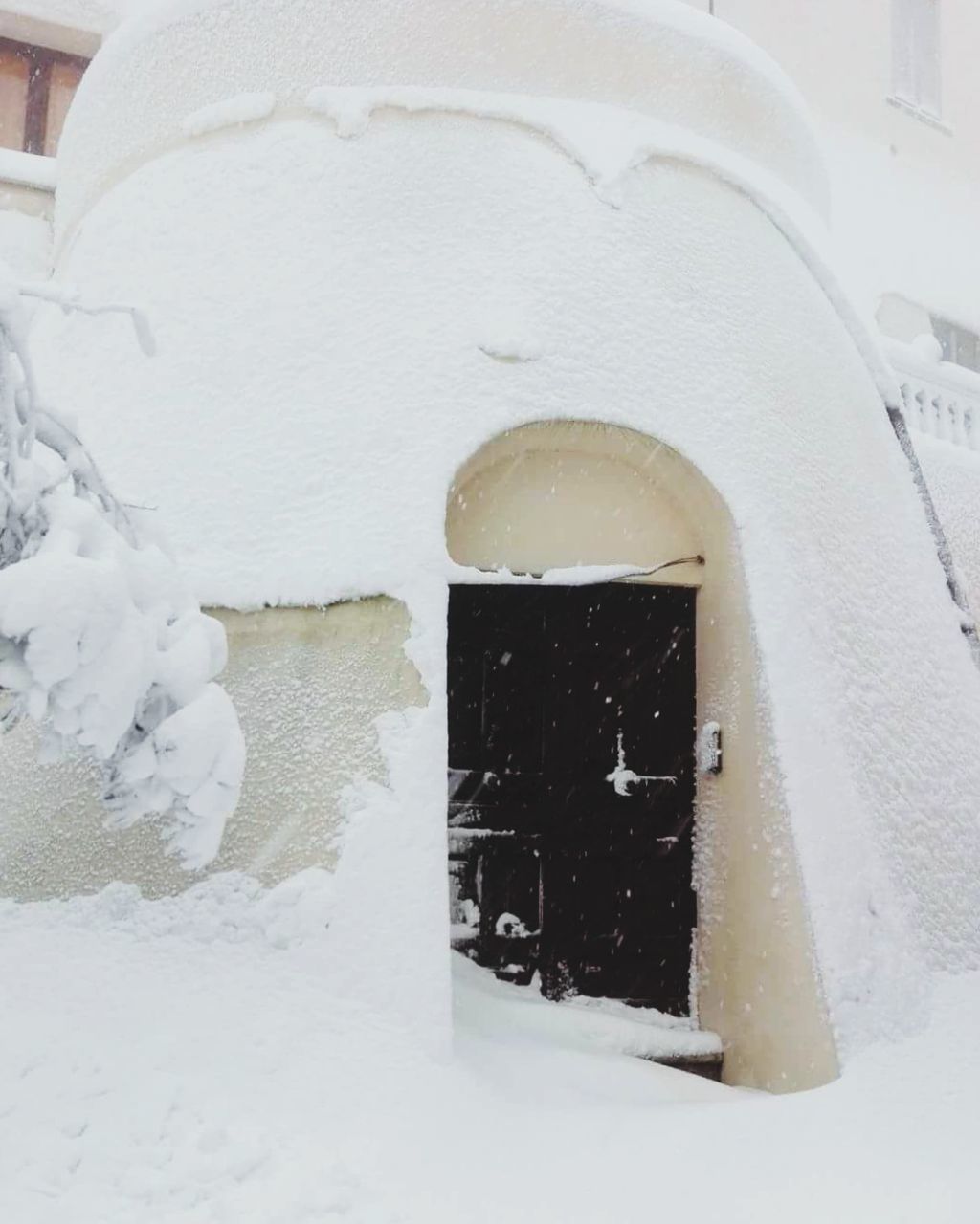 WHITE SNOW COVERED BUILT STRUCTURE