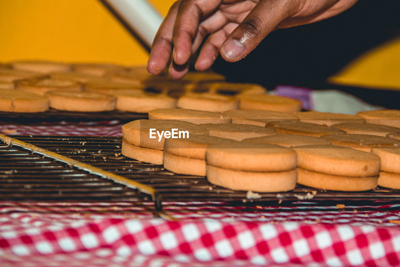 Close-up of person preparing food on table