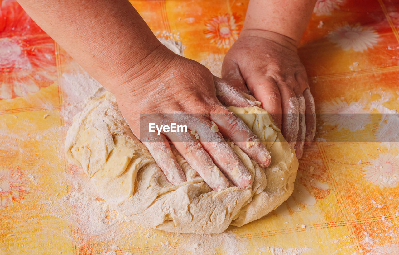 cropped image of man preparing food on table