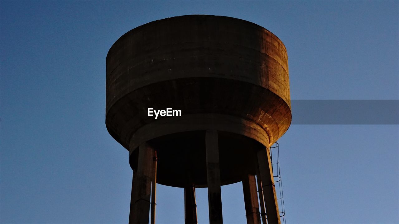 Low angle view of water tank  against clear sky