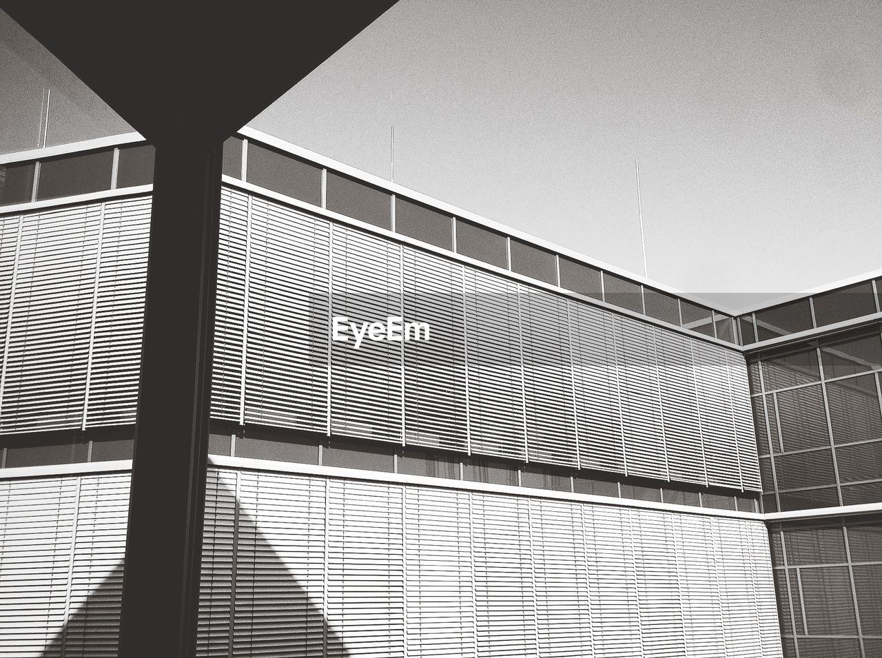 Low angle view of modern office building against sky