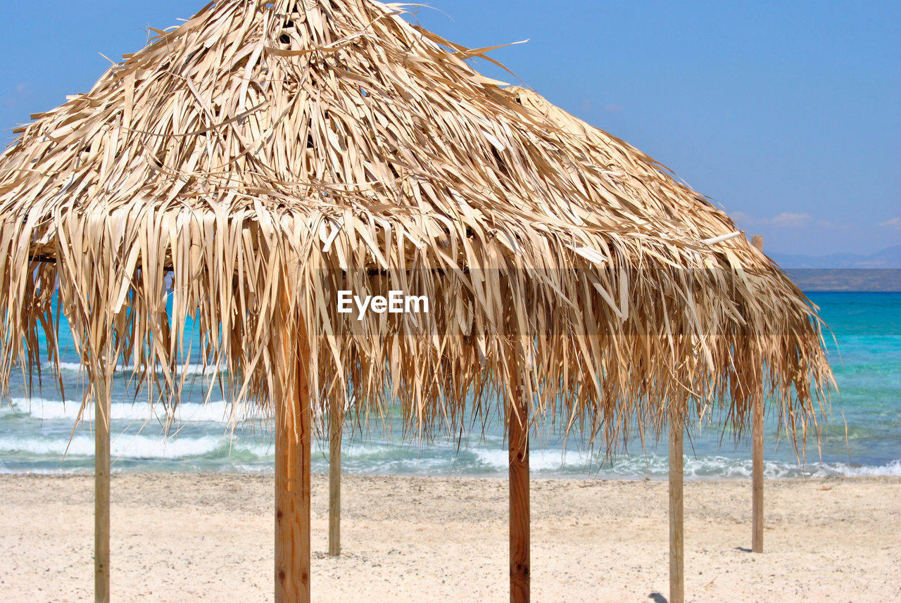 Sun umbrellas row on the beach.