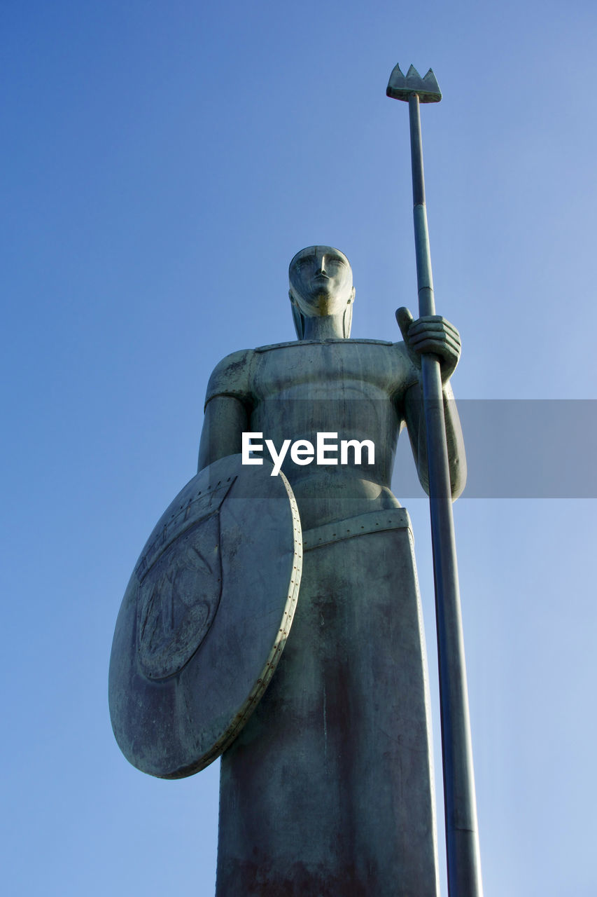 Low angle view of statue against clear sky