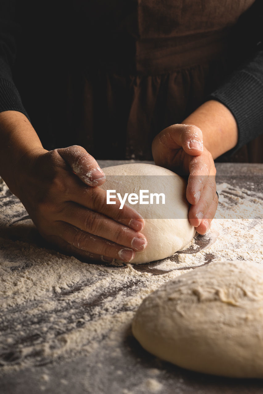 Midsection of person preparing food