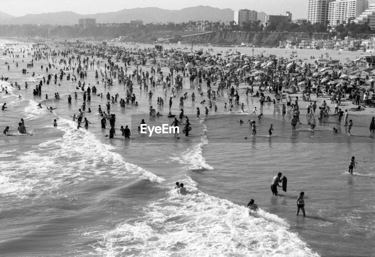 PEOPLE ENJOYING ON BEACH