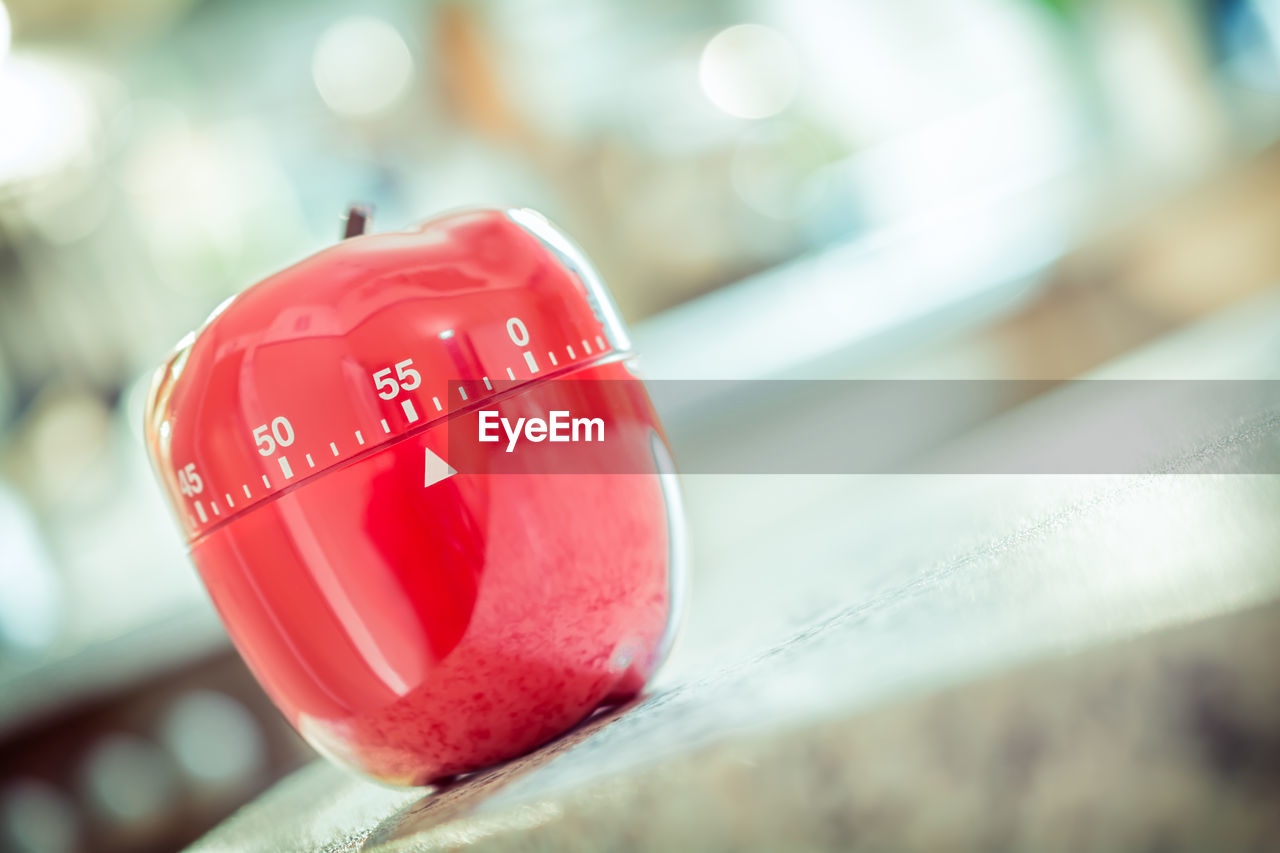 Close-up of apple container with measures on table