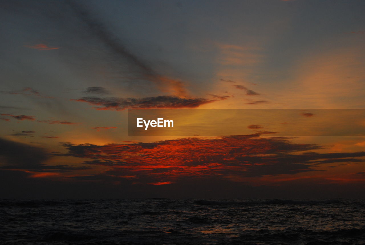 SCENIC VIEW OF SEA AGAINST ROMANTIC SKY