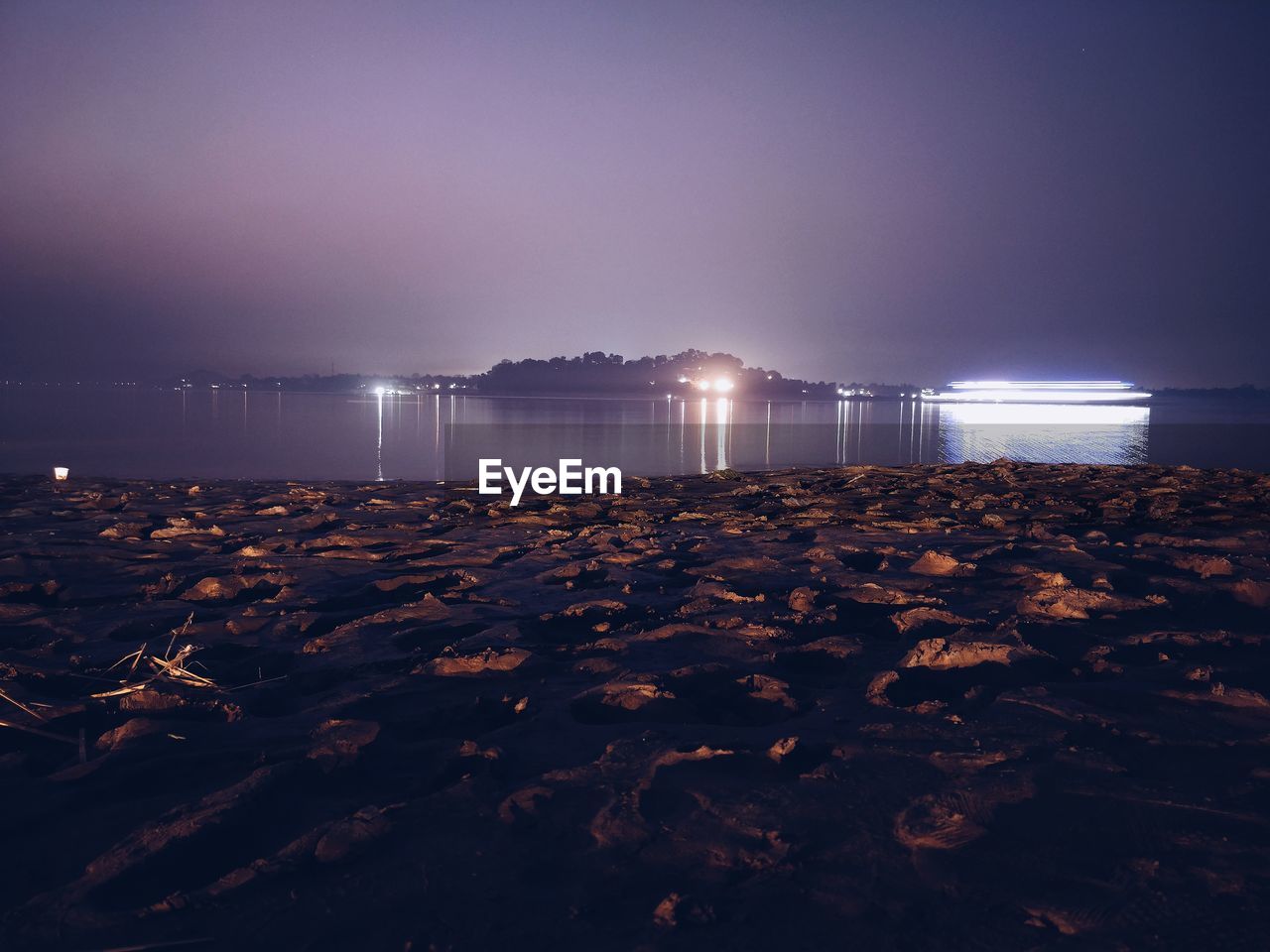 Scenic view of sea against sky at night