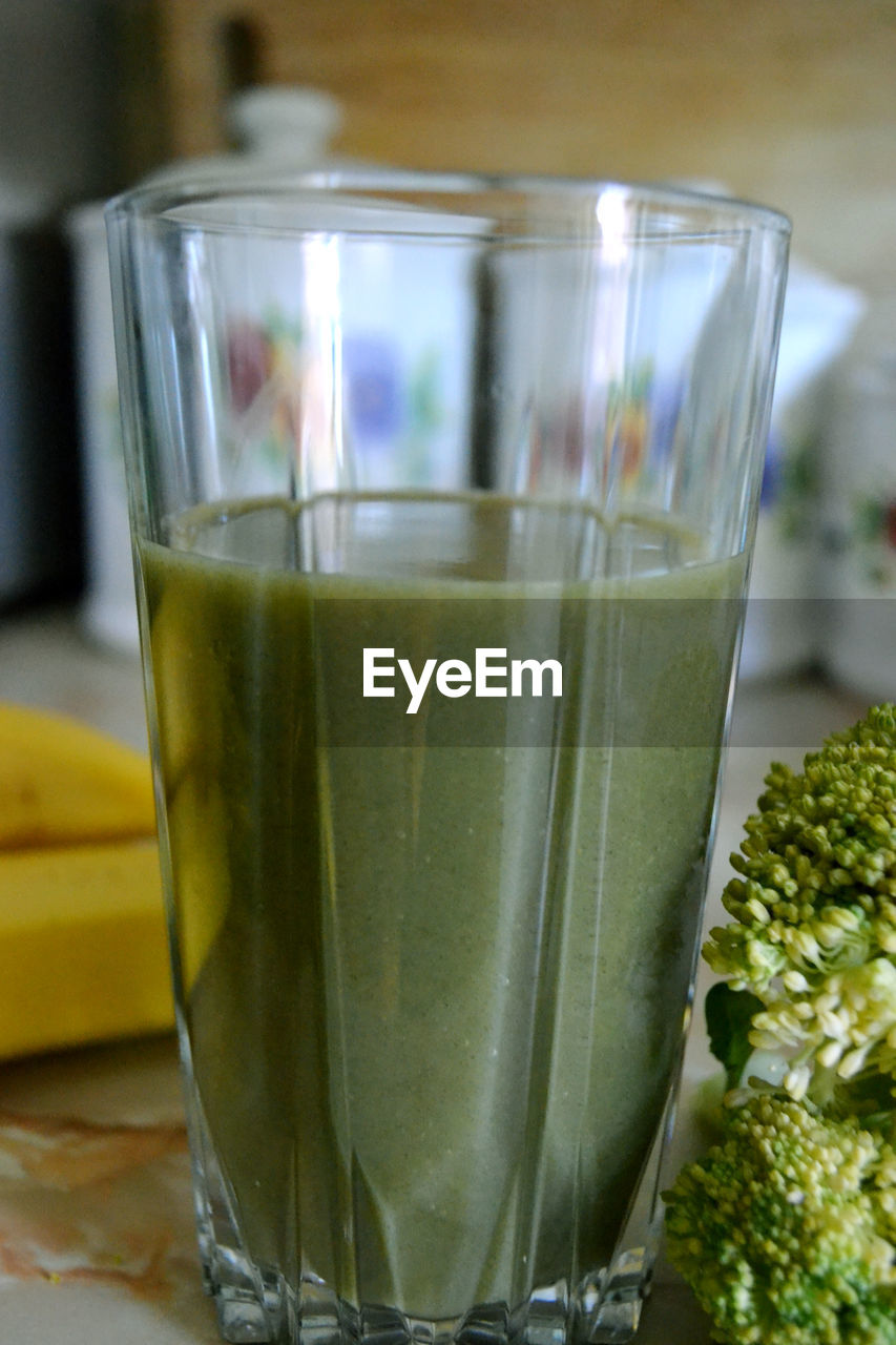 Close-up of broccoli juice in glass