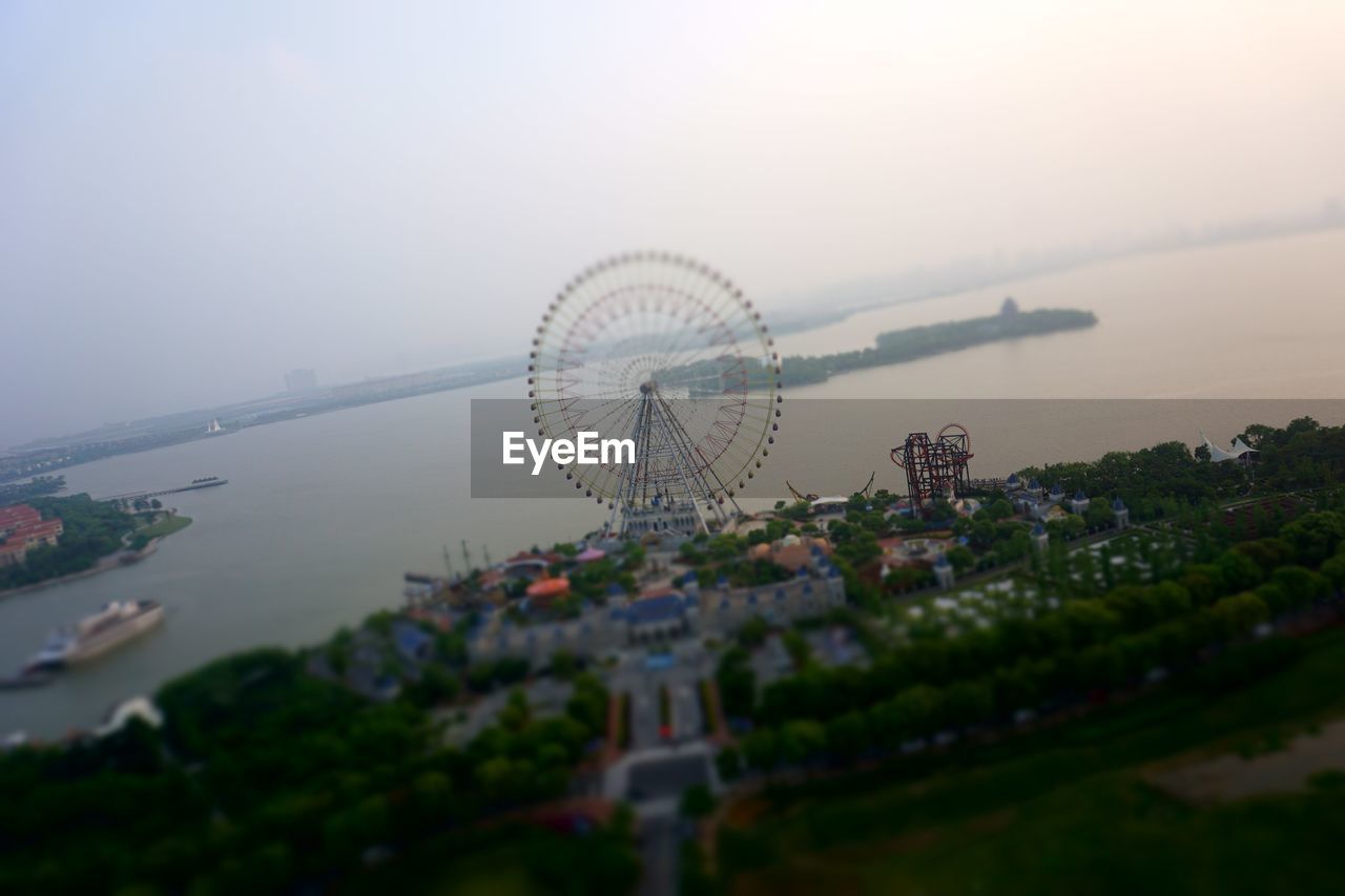 High angle view of ferris wheel in city