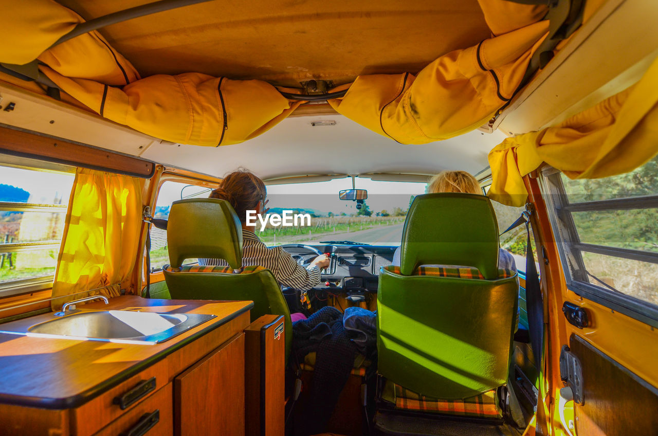 Young couple driving camper