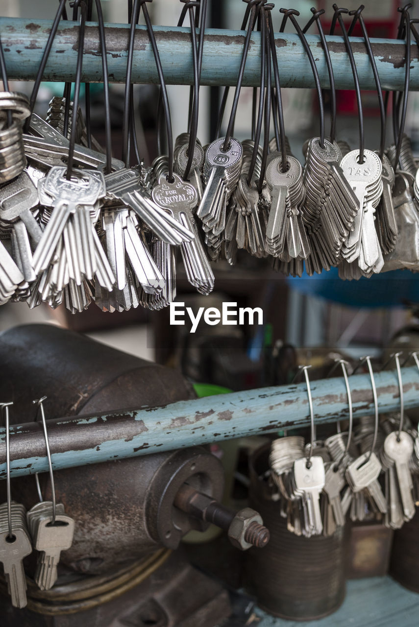 Close-up of keys hanging on rod