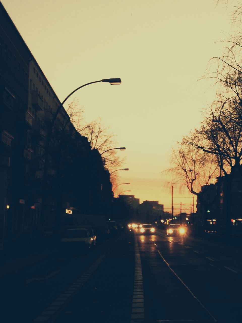 Traffic on city street at dusk