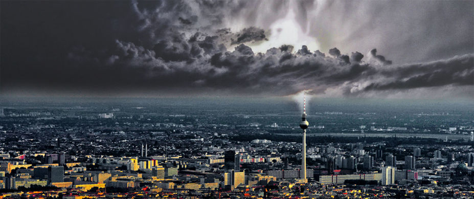 VIEW OF CITYSCAPE AGAINST CLOUDY SKY