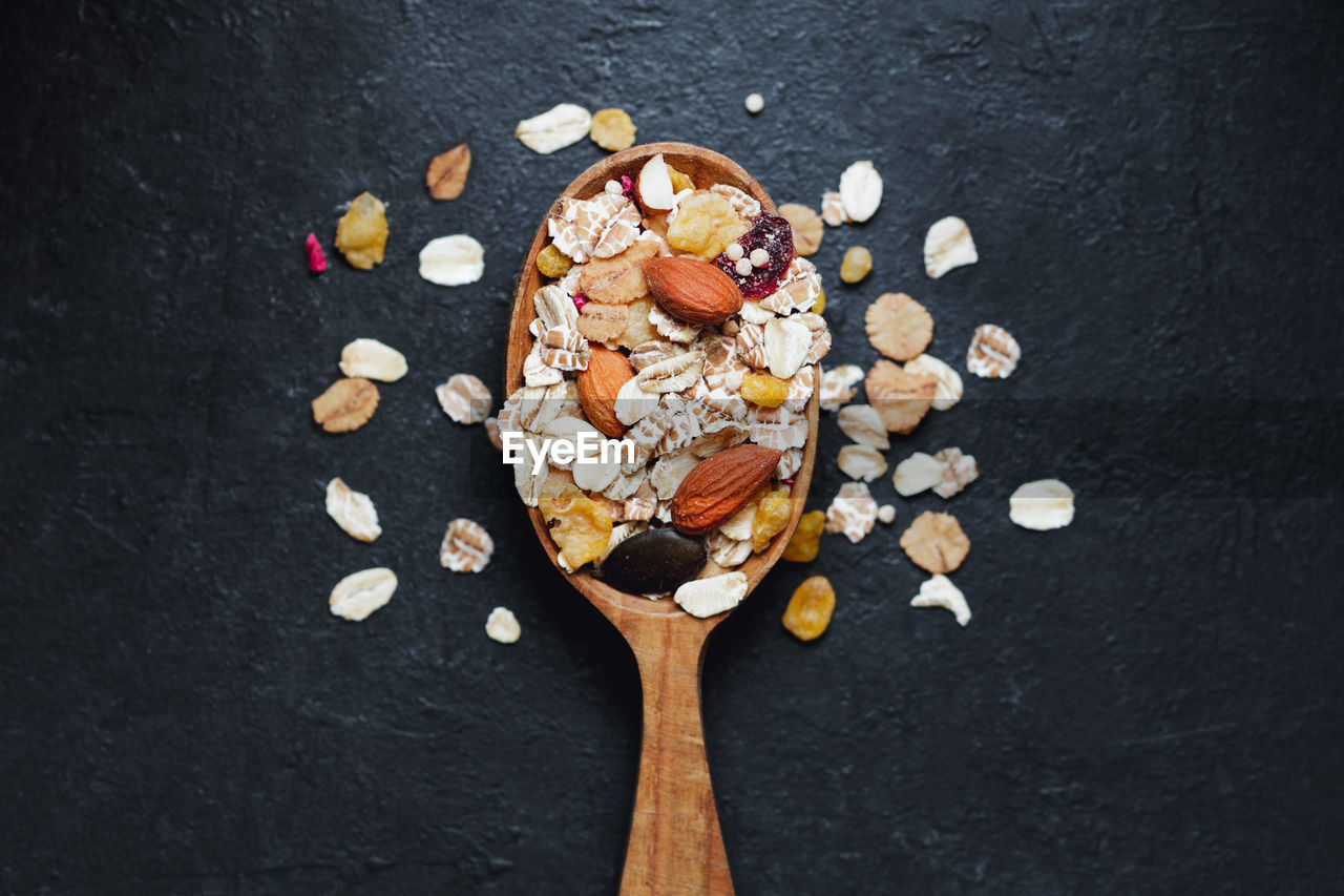 Directly above shot of breakfast in wooden spoon on table