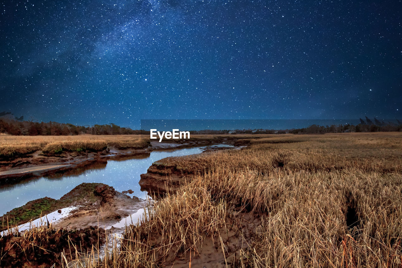 Night stars over the marsh and sesuit creek in east dennis in winter