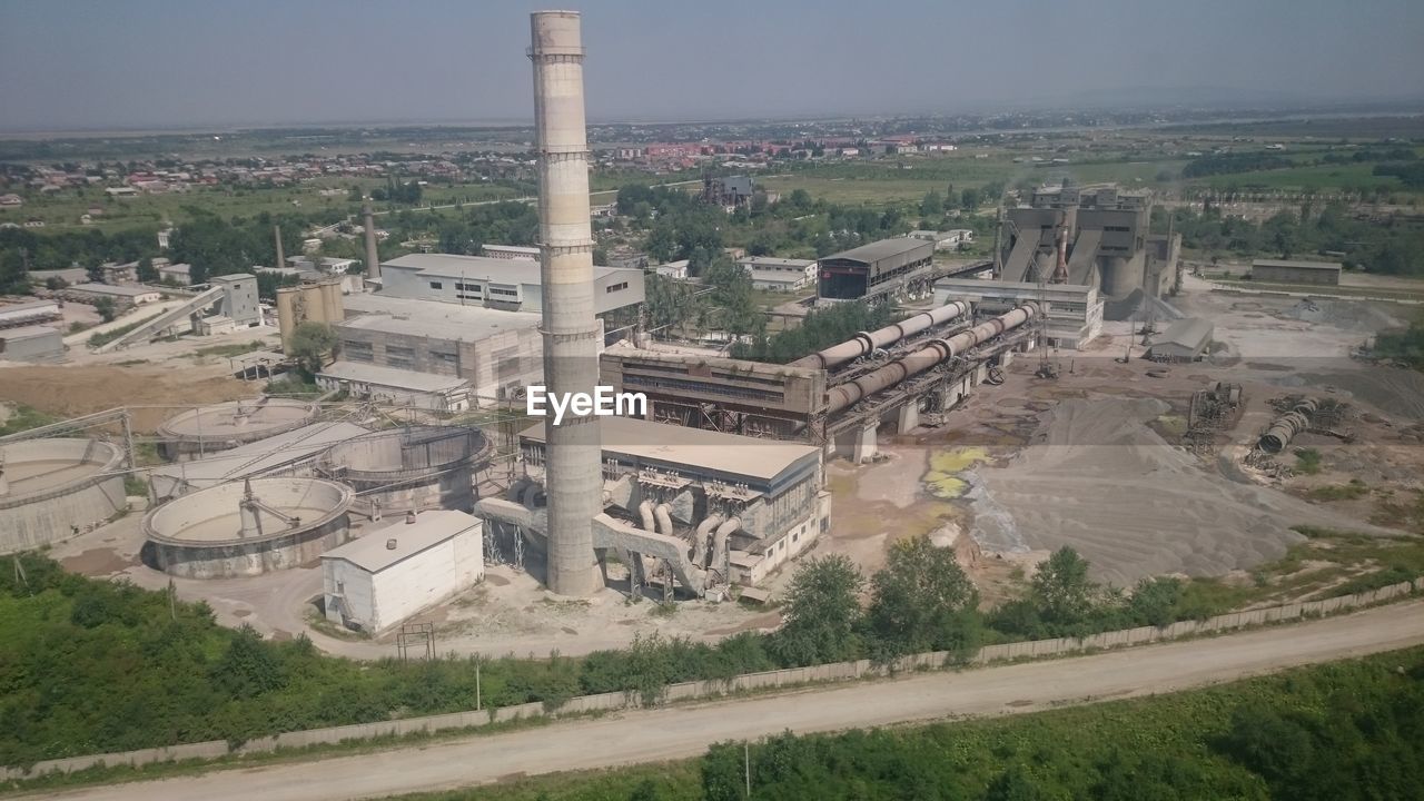HIGH ANGLE VIEW OF FACTORY AT LANDSCAPE