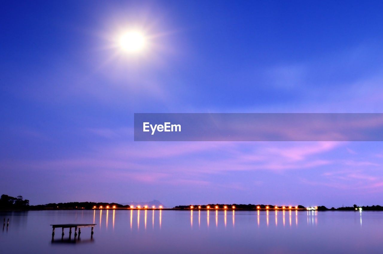 Scenic view of lake against blue sky