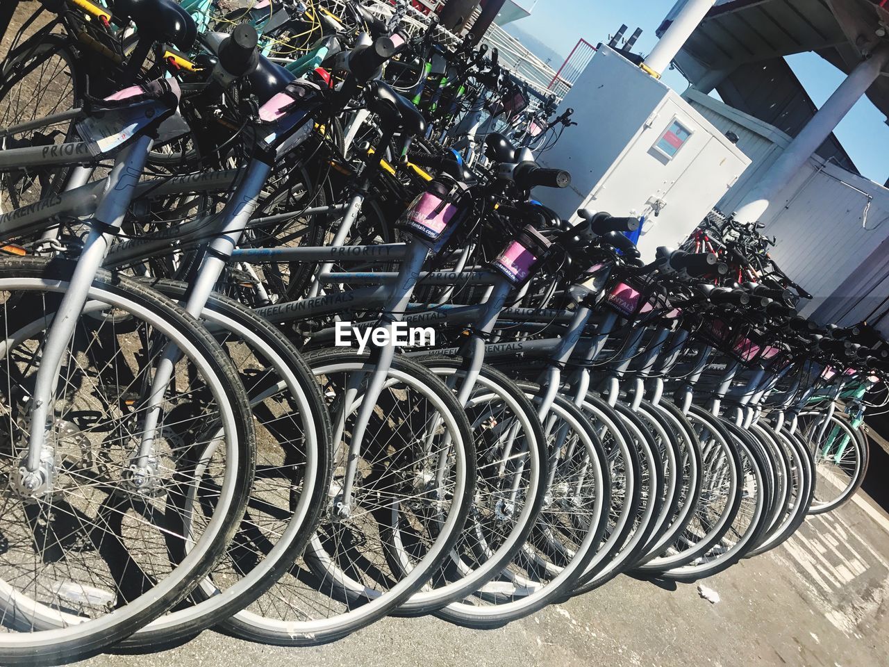 BICYCLES PARKED AT SIDEWALK