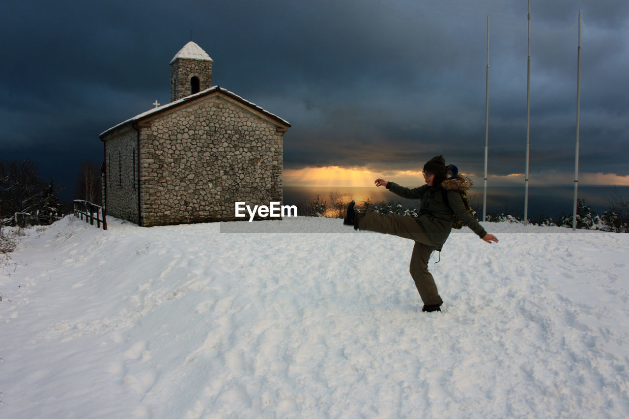 FULL LENGTH OF MAN ON SNOW COVERED LAND