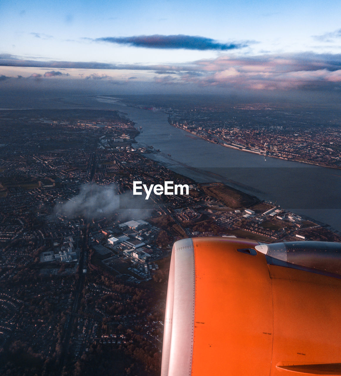 Aerial view of cityscape and jet engine