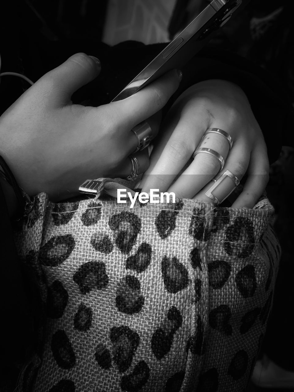 black, black and white, one person, monochrome photography, white, hand, monochrome, women, adult, indoors, limb, person, arm, darkness, clothing, finger, close-up, pattern, fashion, midsection, human leg, holding, lifestyles
