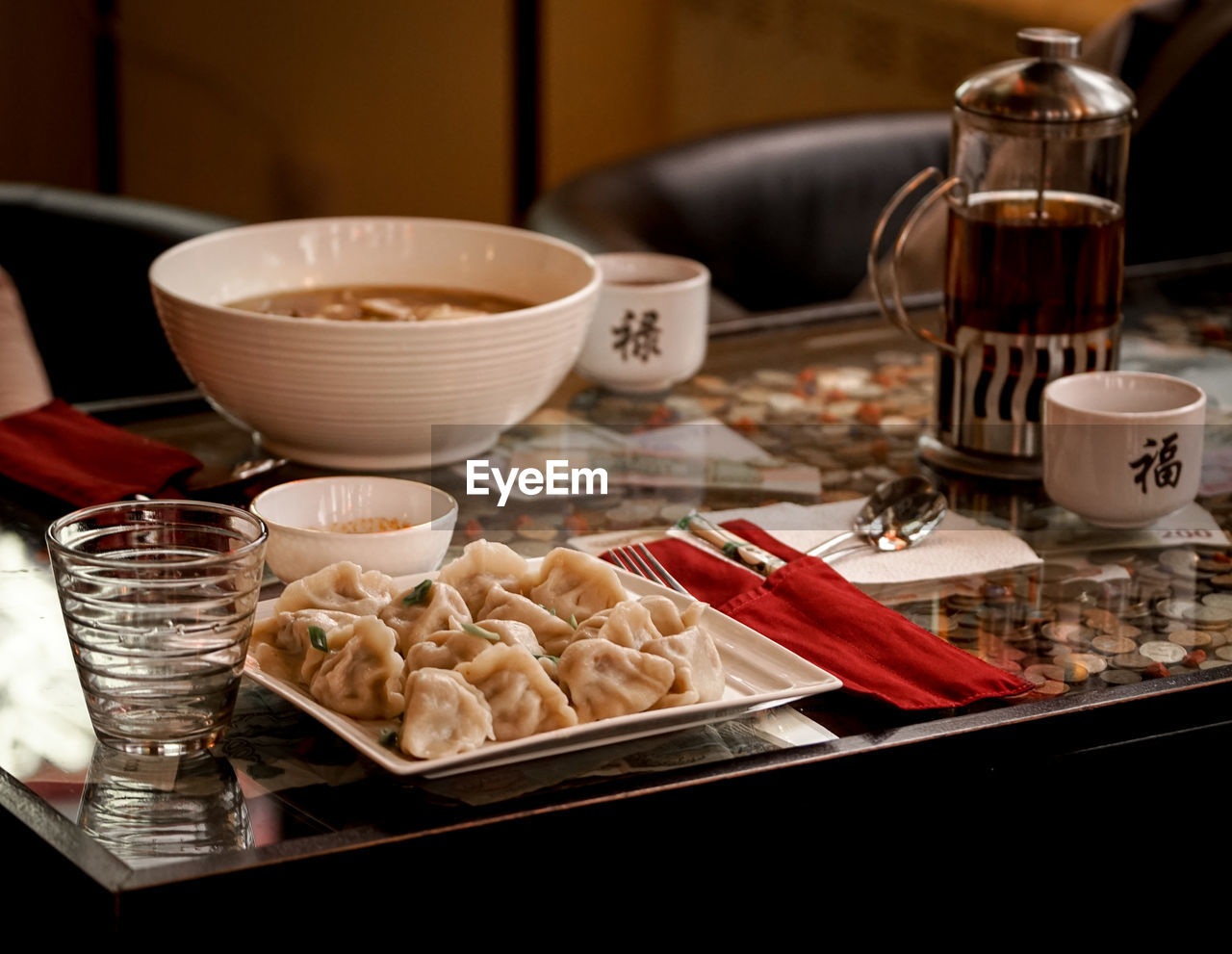 Close-up of chinese food in glass on table