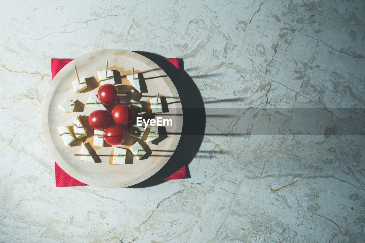 High angle view of cherries in bowl on table