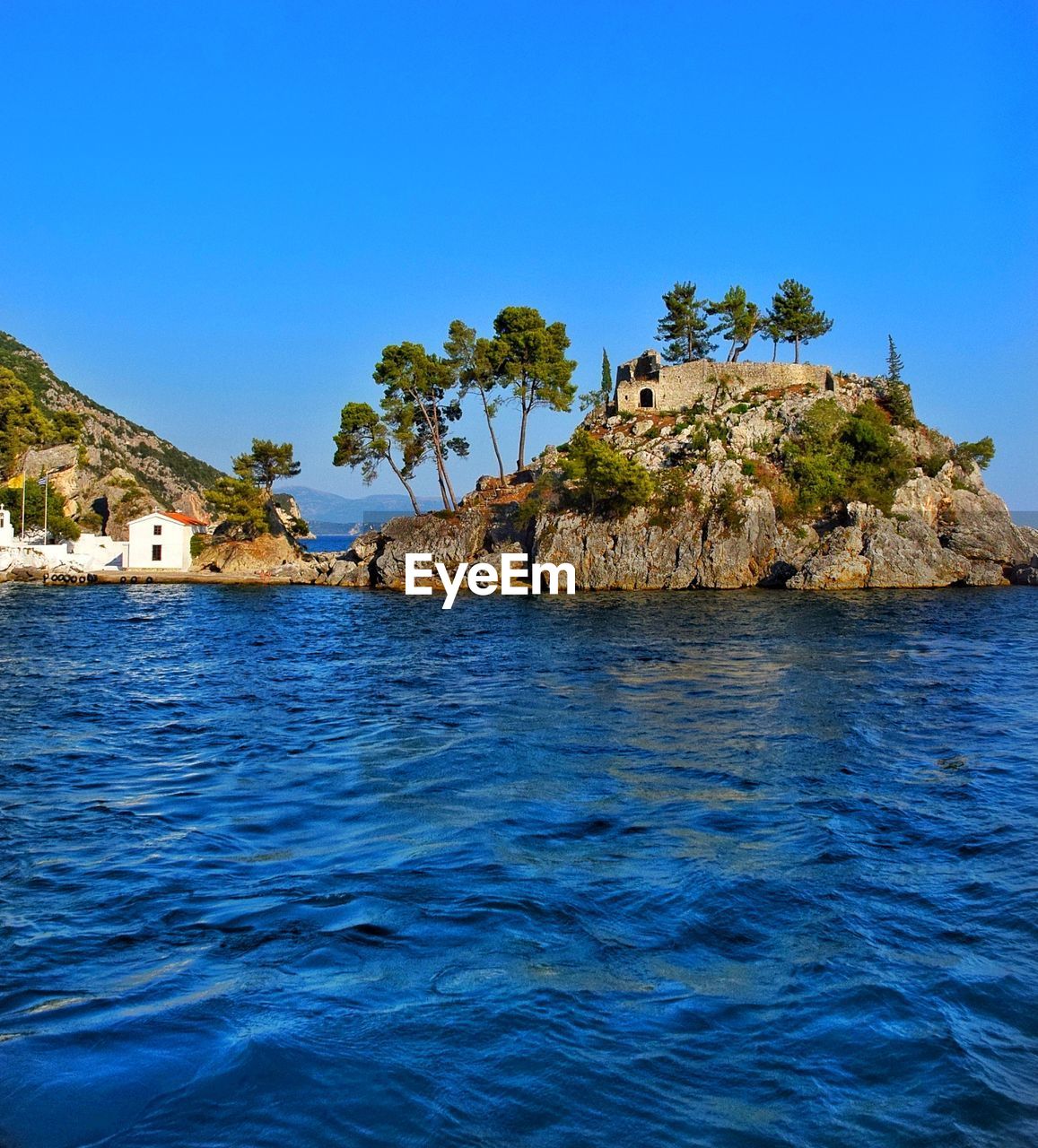 Scenic view of sea against clear blue sky