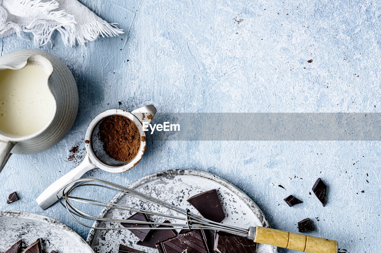 Chocolate ganache truffle ingredients in a kitchen flat lay