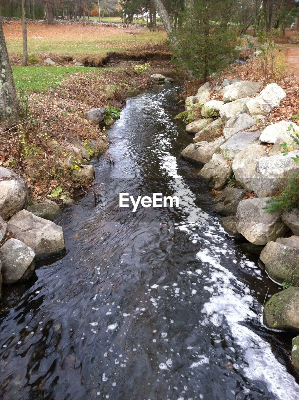 STREAM FLOWING THROUGH ROCKS